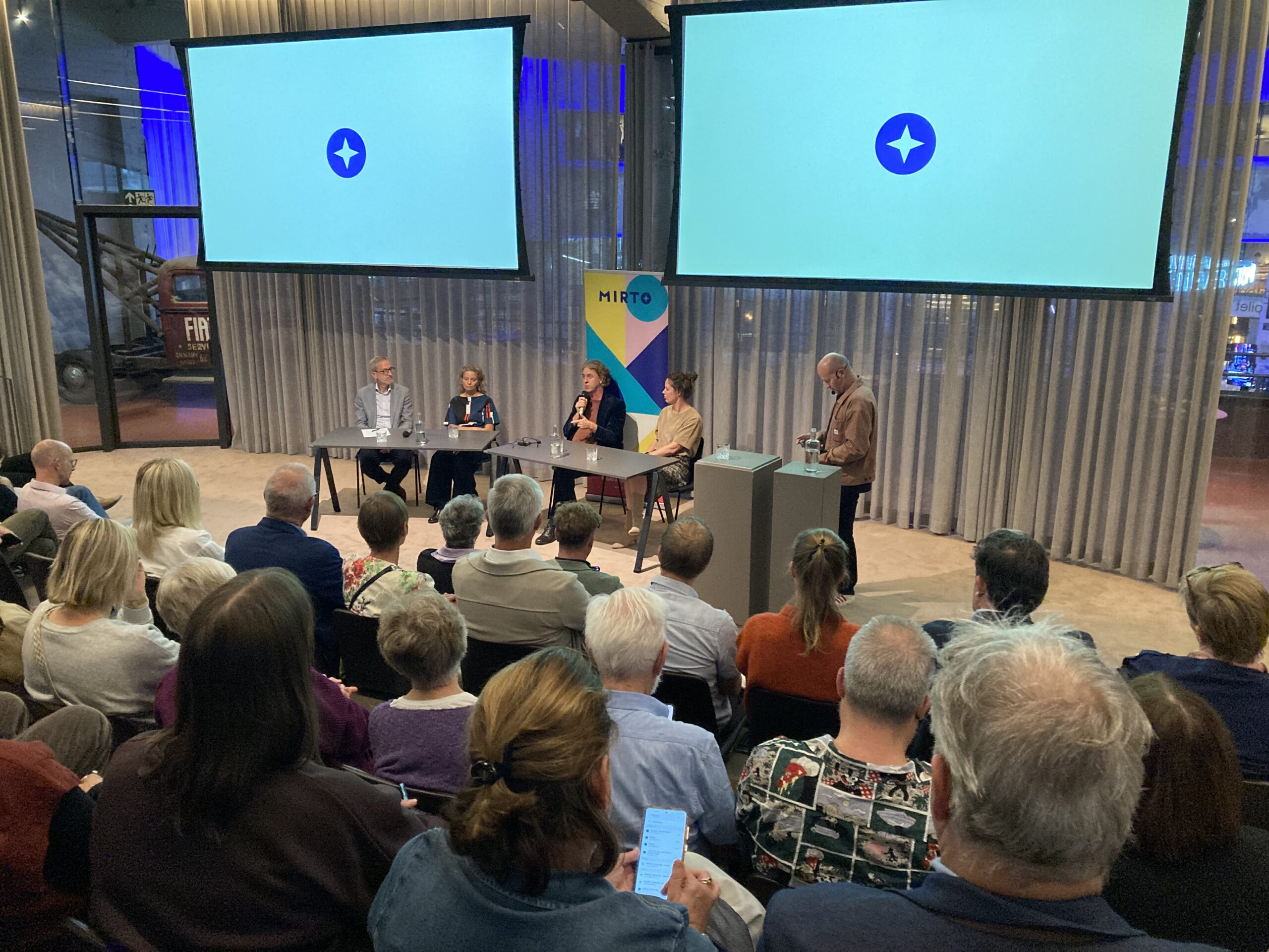 Panelgesprek tijdens het jubileumevent van Mirto